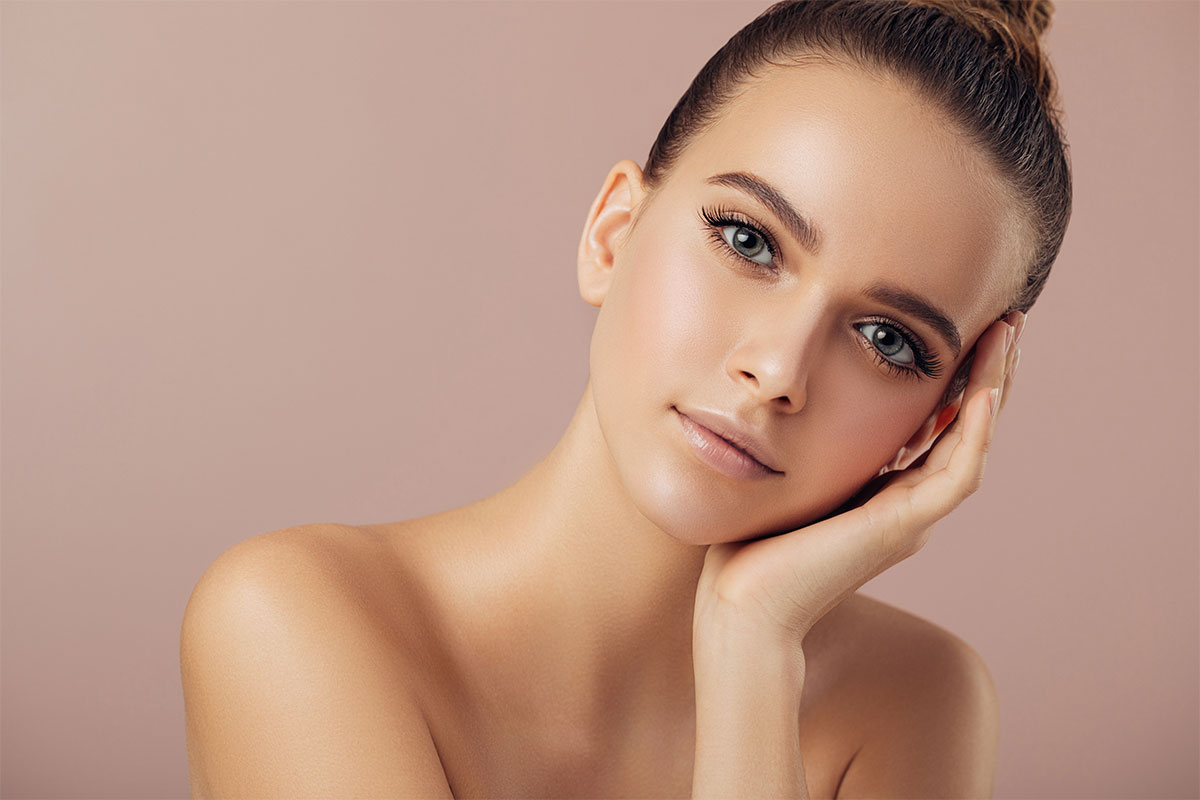 Woman content with her well shaped jaw after corrective jaw surgery in Thousand Oaks.